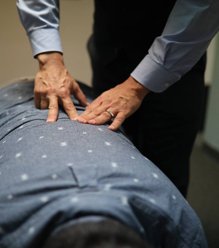 Dr. Mark Lique performing a chiropractic adjustment in Haverhill, MA